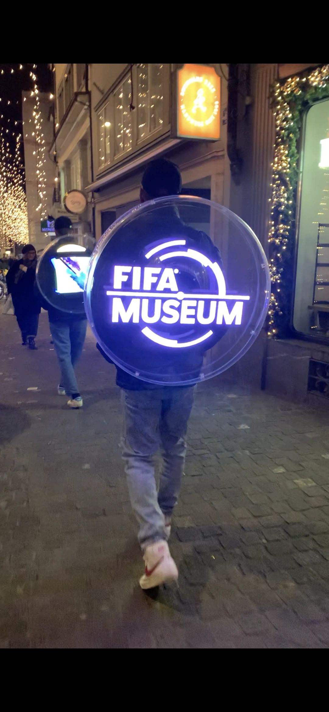 FIFA Museum holographic backpack displaying the museum logo during the street campaign.
